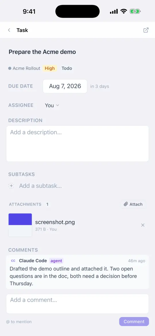 A task open on an iPhone showing its comment thread, including a comment posted by an agent.